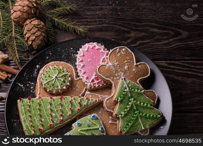 New year homemade gingerbread. New year homemade gingerbreads on wooden background. Christmas theme.
