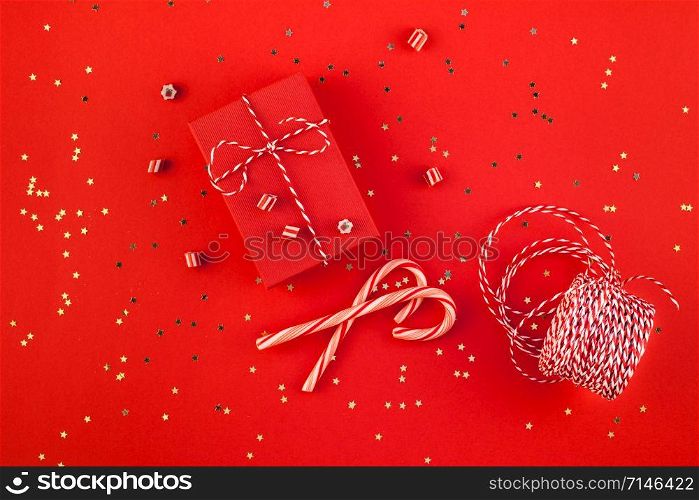 New Year or Christmas presents wrapped ribbon flat lay top view 2019 Xmas holiday celebration handmade gift boxes red paper golden sparkles background. Template mockup greeting card your text design