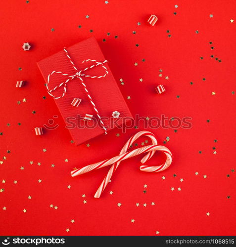 New Year or Christmas presents wrapped ribbon flat lay top view Xmas holiday 2019 celebration handmade gift boxes red paper golden sparkles background. Square Template mockup greeting card text design