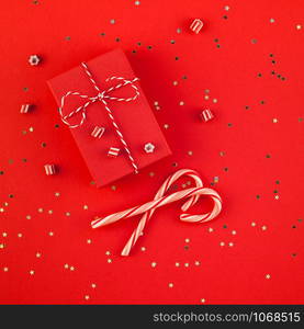 New Year or Christmas presents wrapped ribbon flat lay top view Xmas holiday 2019 celebration handmade gift boxes red paper golden sparkles background. Square Template mockup greeting card text design