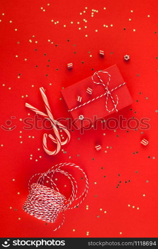 New Year or Christmas presents wrapped ribbon flat lay top view Xmas holiday 2019 celebration handmade gift boxes red paper golden sparkles background. Template mockup greeting card your text design