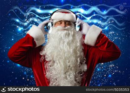 New Year party. Santa Claus wearing headphones and enjoying music
