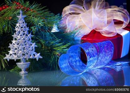 New Year&rsquo;s still life. New Year&rsquo;s still life. Decorations and ribbons on a bright color background