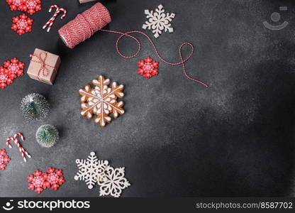 New Year&rsquo;s toys and decorations on a dark concrete background. Getting home ready for Christmas celebrations. Christmas toys and decorations on a dark concrete background