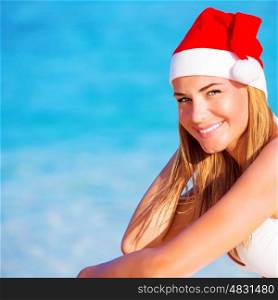 New Year vacation, happy blond girl enjoying Maldives, wearing red Santa hat, travel to exotic country on winter holidays&#xA;