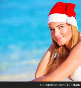 New Year vacation, happy blond girl enjoying Maldives, wearing red Santa hat, travel to exotic country on winter holidays, copy space