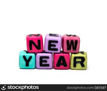 new year - word made from multicolored child toy cubes with letters