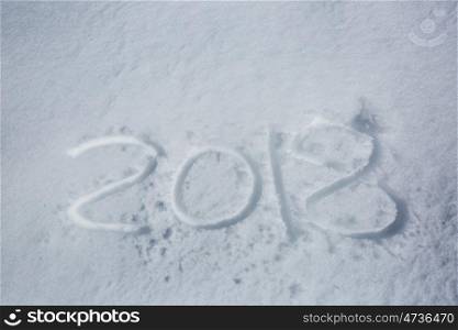 new years date 2018 written in snow background