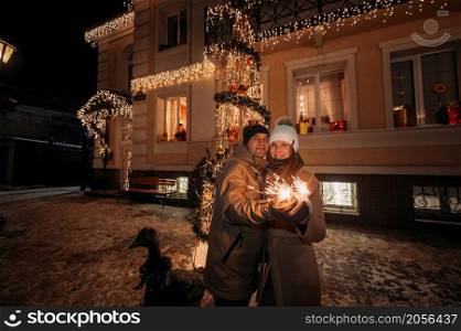 New Years story of a young couples walk.. A young couple walks through the streets of a decorated city 3072.