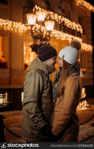 New Years story of a young couples walk.. A young couple walks through the streets of a decorated city 3073.