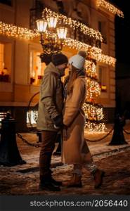 New Years story of a young couples walk.. A young couple walks through the streets of a decorated city 3074.
