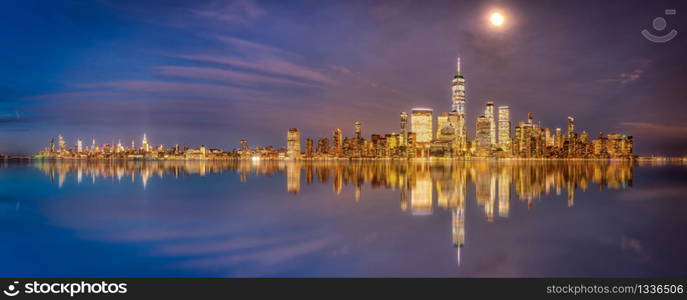 New York and New Jersey skyline from new jersey deck at sunset blue hour with reflection on hudson river