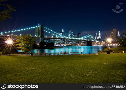 New York, Brooklyn Bridge at night. View from Brooklyn at Manhattan