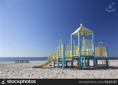 New York City, 15 september 2015: playground equipment on beach of coney island with blue sky