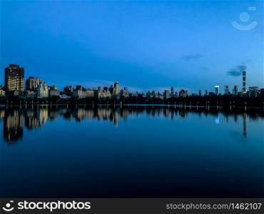 New York City at Dusk with Reflection on Jacqueline Kennedy Onassis Reservoir at Central Park