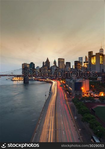 New York City at sunset with Brooklyn Bridge, USA