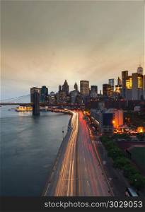 New York City at sunset with Brooklyn Bridge, USA