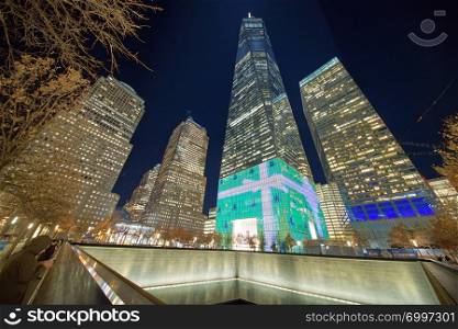 NEW YORK CITY - DECEMBER 4TH, 2018: Tall skyscrapers of Downtown Manhattan at night. This is the most growing district of New York City.