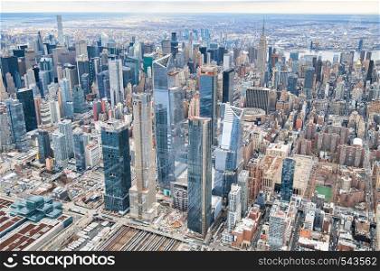 New York City from helicopter point of view. Midtown Manhattan and Hudson Yards on a cloudy day, USA