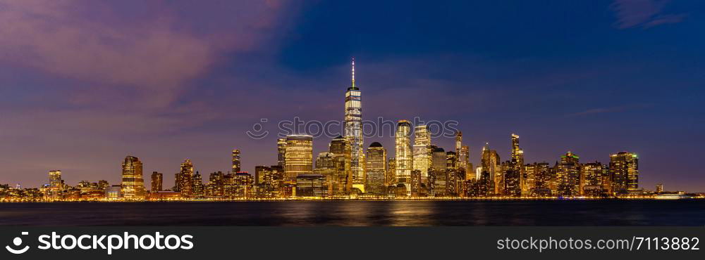 New York city Lower Manhattan skyline cityscape at dusk from New Jersey.