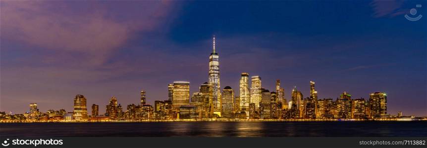 New York city Lower Manhattan skyline cityscape at dusk from New Jersey.