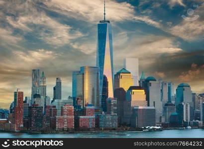 New York City Manhattan skyline at sunset over Hudson River viewed from New Jersey