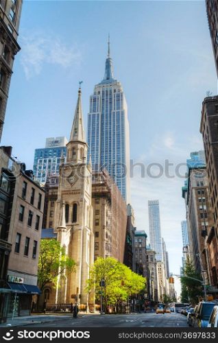 NEW YORK CITY - MAY 12: The Marble Collegiate Church and Empire State building on May 12, 2013 in New York. This church, founded in 1628, is one of the oldest continuous Protestant congregations in North America.