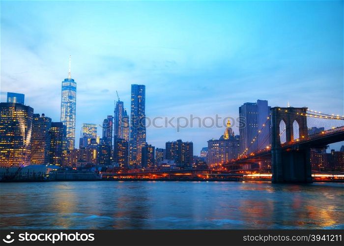 New York City overview with Brooklyn bridge at sunset