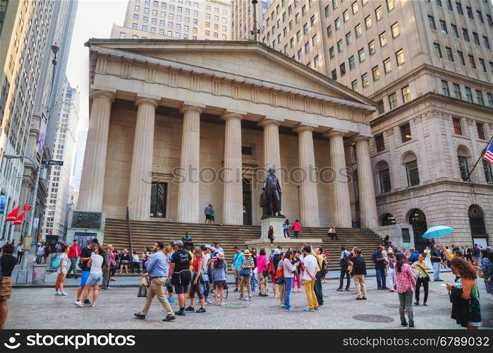 NEW YORK CITY - SEPTEMBER 3: Federal Hall National Memorial on Wall Street with people on September 3, 2015 in New York City.