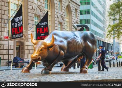 "NEW YORK CITY - September 5: Charging Bull sculpture on September 5, 2015 in New York City. The sculpture is both a popular tourist destination, as well as "one of the most iconic images of New York"."