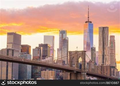 New York City skyline cityscape of Manhattan with brooklyn bridge in USA at sunset