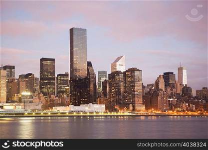 New York City skyline lit up at dusk