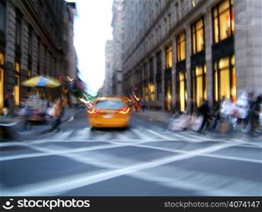 New York City street in motion with yellow cab