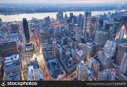 New York City, USA. Night aerial view of Midtown Manhattan skyscrapers from a high viewpoint.