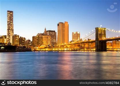 New York mid town with Brooklyn bridge at dusk, USA