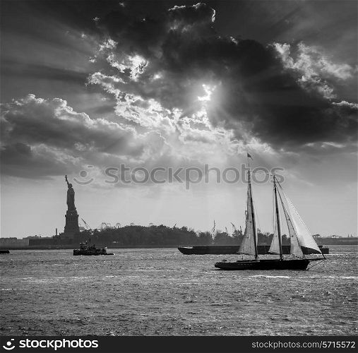 New York sailboat sunset and Statue of Liberty from Manhattan US