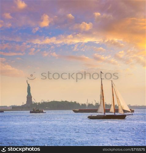New York sailboat sunset and Statue of Liberty from Manhattan US