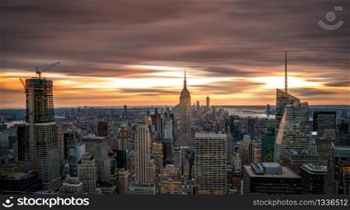 New York skyline from Top of the Rock Rockefeller center in USA at sunset blue hour