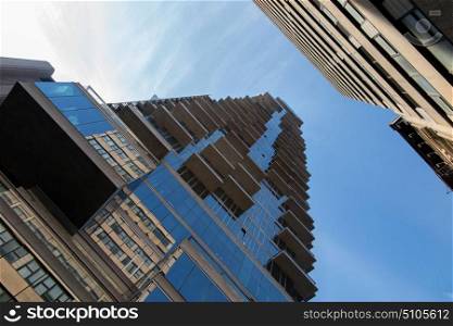 NEW YORK, USA - NOVEMBER 30, 2016: View of New York. The facades of skyscrapers in the narrow streets of New York, view from the bottom up