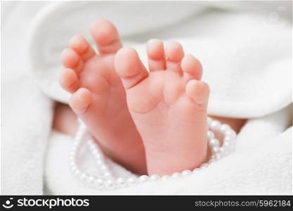 newborn baby feet in a towel