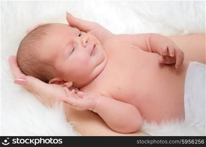 Newborn baby in mother arms (color)