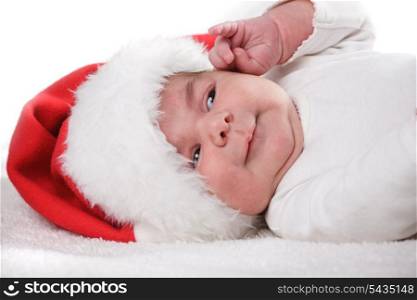 Newborn baby in Santa hat closeup