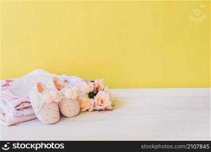 newborn concept with clothes rose