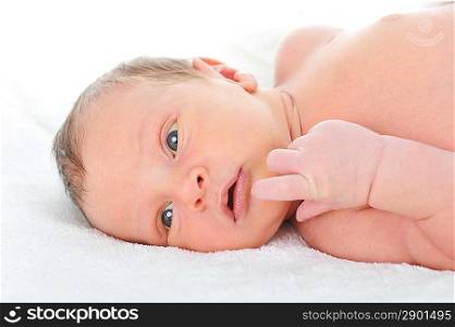 Newborn cute baby on white blanket