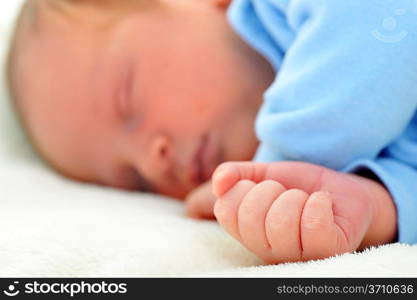 Newborn cute baby sleeping on white blanket