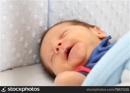Newborn smiling in his dream