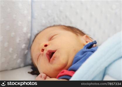Newborn yawing. Focus in the mouth