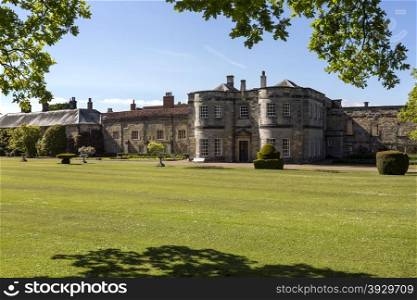 Newburgh Priory is a large country house near Coxwold, North Yorkshire, England. Standing on the site of an Augustinian priory, founded in 1145, it is a stately home in a rural setting with views to the Kilburn White Horse in the distance.