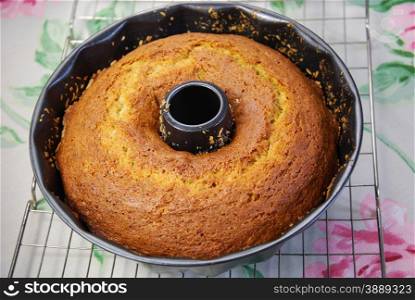 Newly baked banana sponge cake in a nonstick form.
