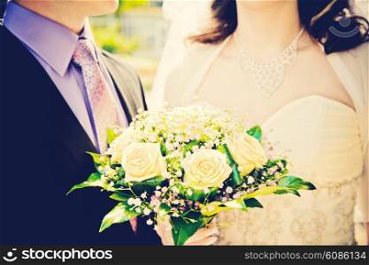 newly married couple with wedding bouquet